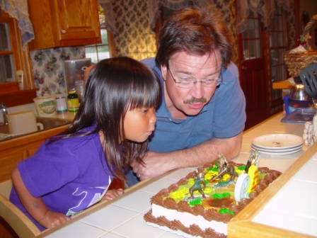 Kasen and Dad blowing out candles